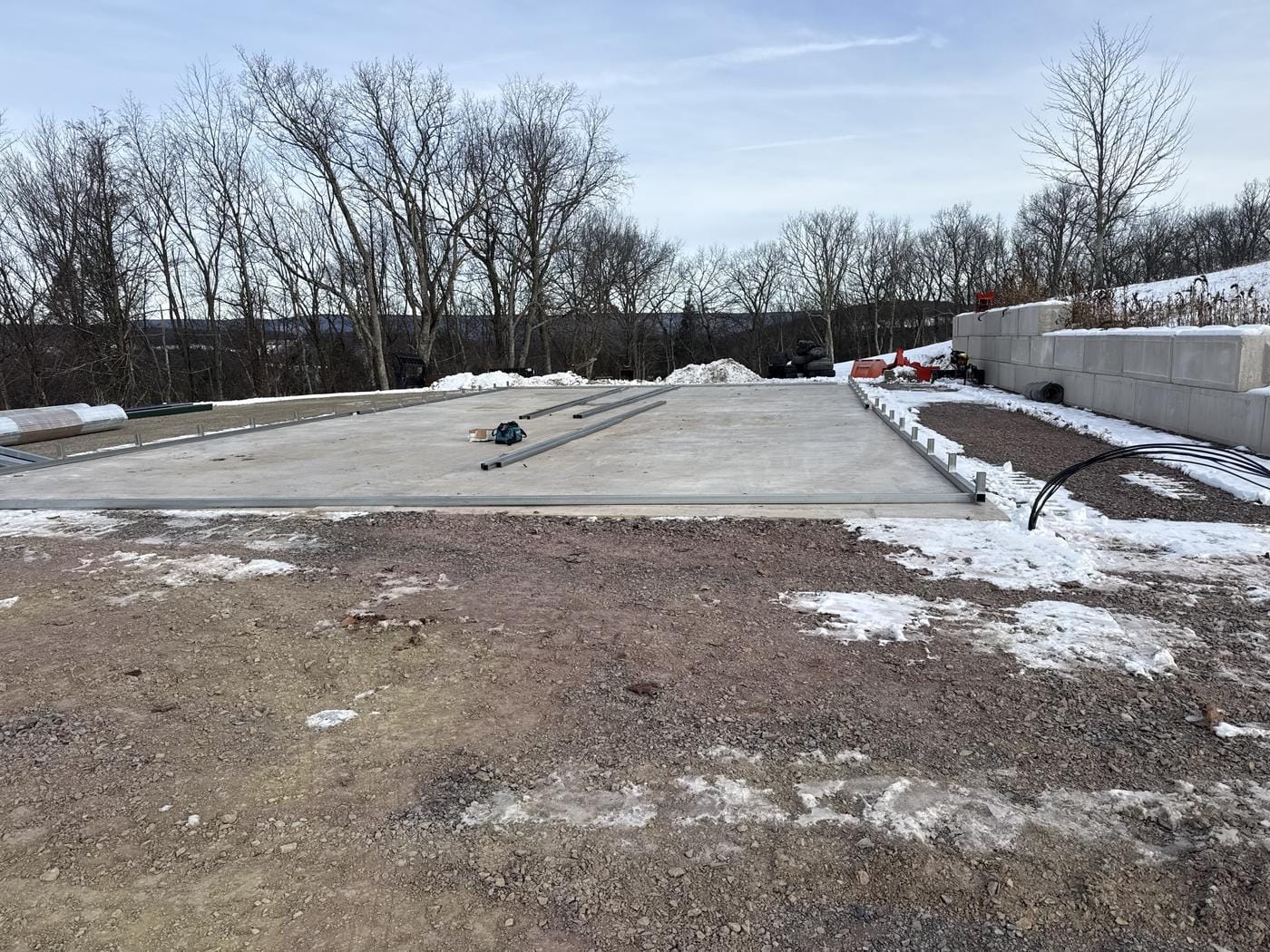 A finished slab with block along one side, in the snow.
