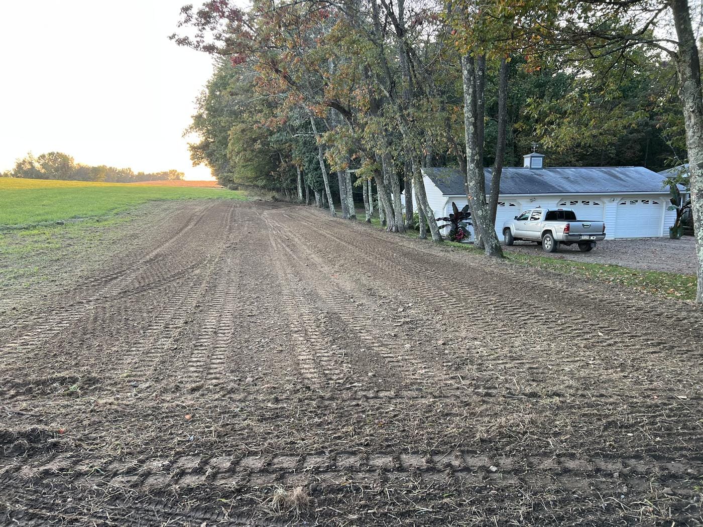A long strip graded smooth along the tree line.