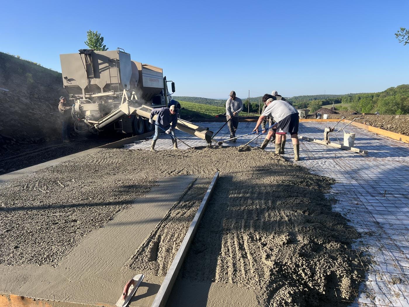 Concrete going down on the prepped pad.